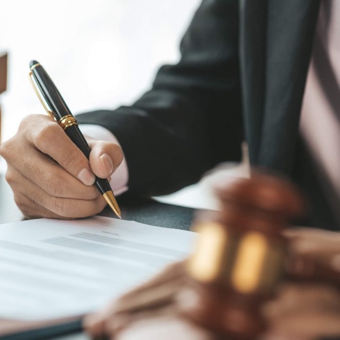 Lawyer writing agreement