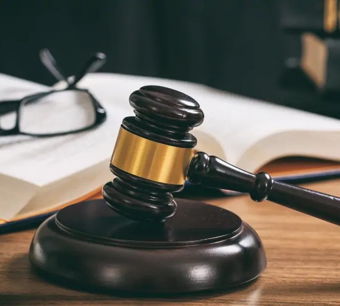 Lawyers desk with book and gavel